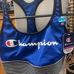 Champion sports bra. Blue with black and white stripes, size XS. New with tags!